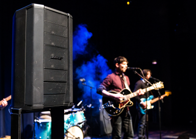 Bose F1 812 and Bose F1 Sub on stage with a band